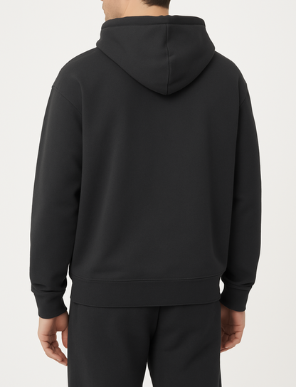 basic donkergrijs vest achterkant met gouden rits van desons met een oversized pasvorm op een mannelijk model met een zwarte broek